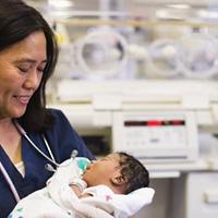 Nurse holding a newborn