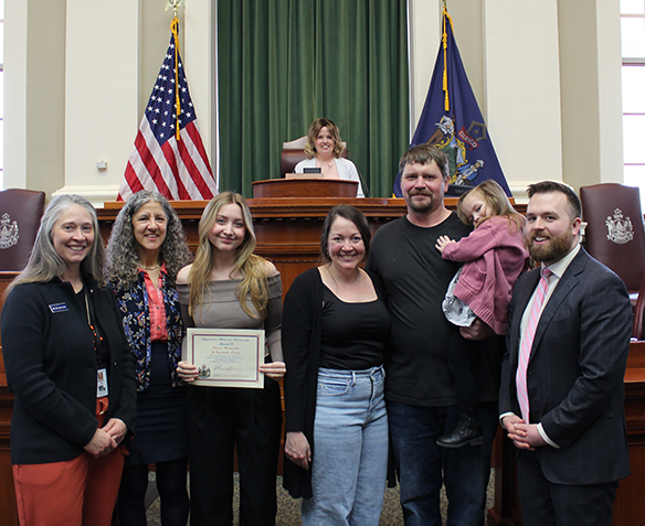 Rep. Cluchey with scholarship recipient and family